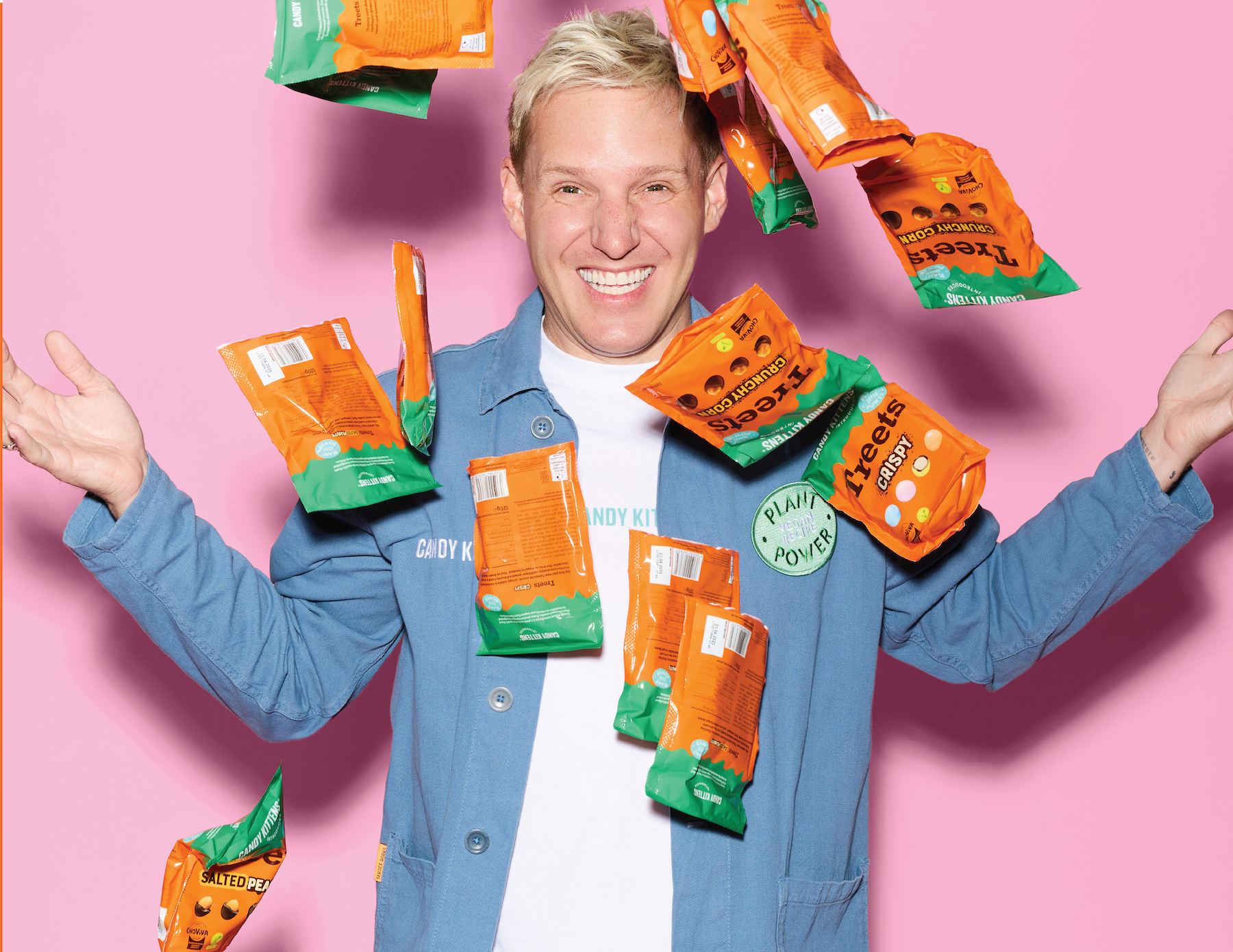 Bags of Treets raining down against a pink background